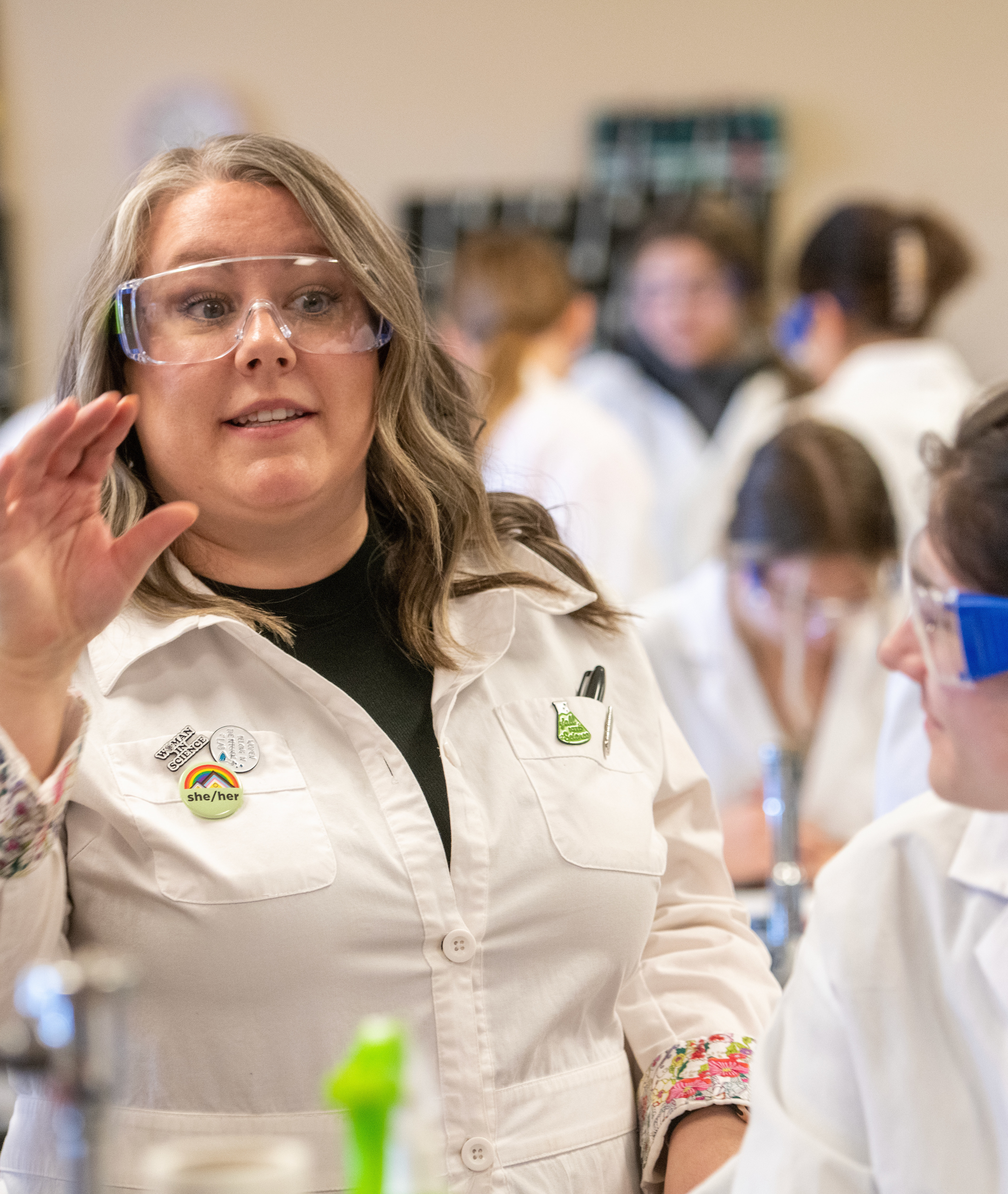 Science teacher talks to class during a lab