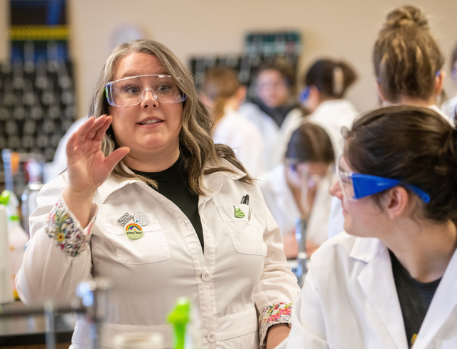 Science teacher talks to class during a lab
