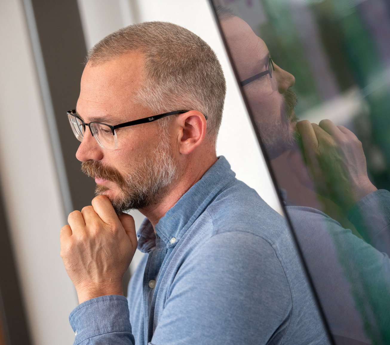 A professor looks onto his class while teaching