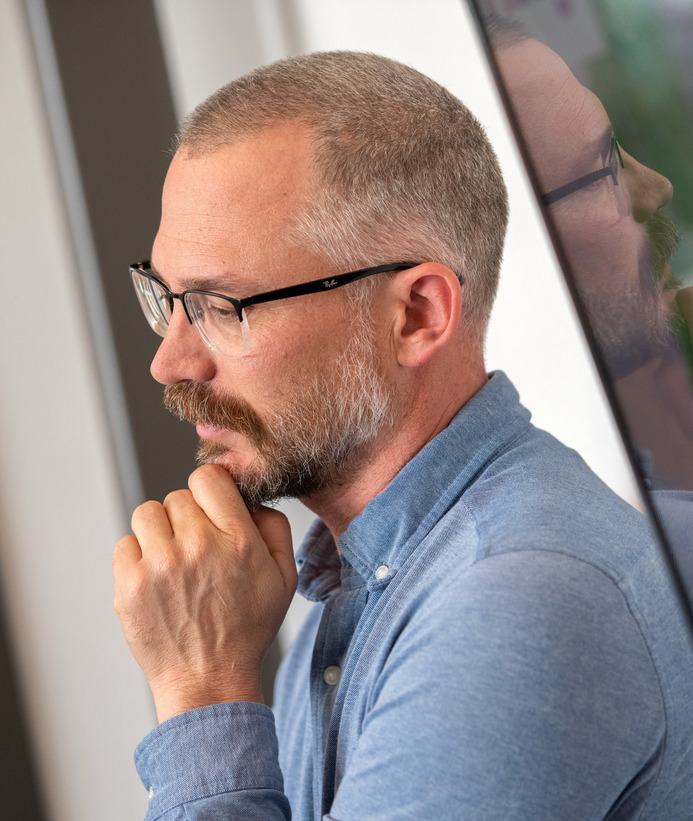 Mathematics graduate student works on a dry erase board