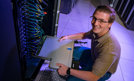 Student smiles in the advanced computing center