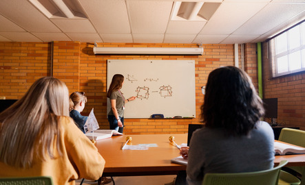 Students look at the board during a math class