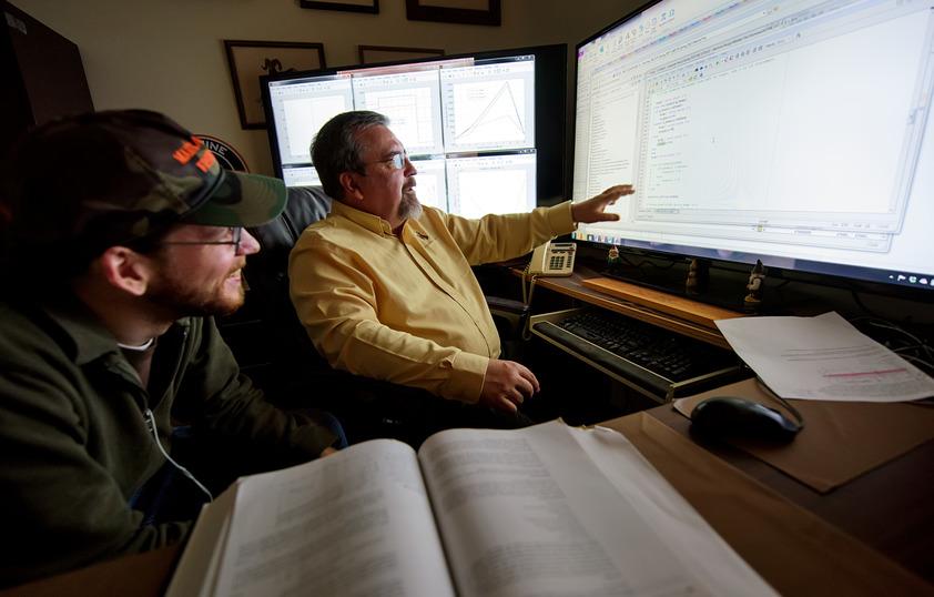 Faculty member working with student in office