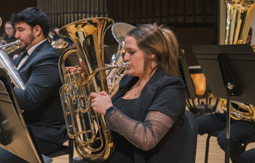 A student plays the baritone during a concert