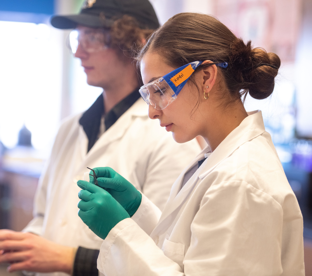 Student wearing goggles in a lab