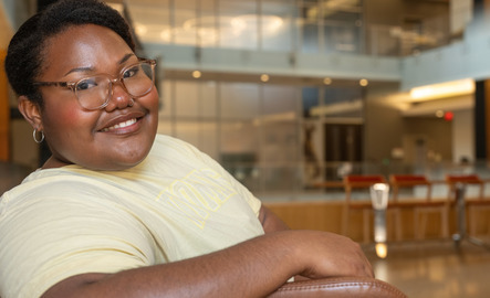 A student smiles for a photo