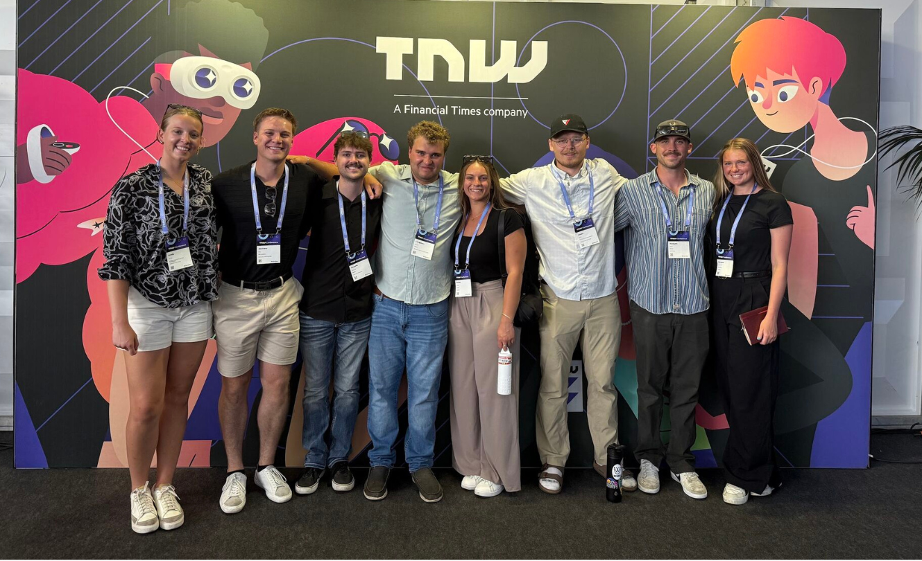 A group of students smile for a photo
