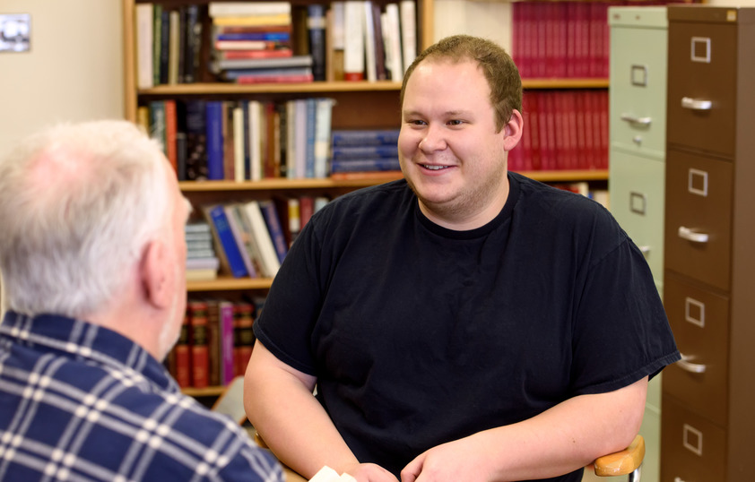 Student talking to professor