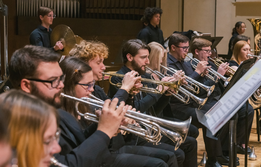 Trumpet section playing at concert