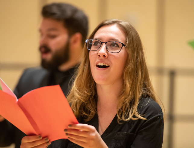 Student singing at a choir performance