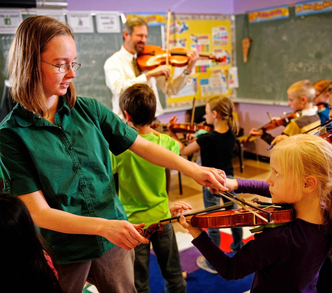 Music teacher teaching vocals