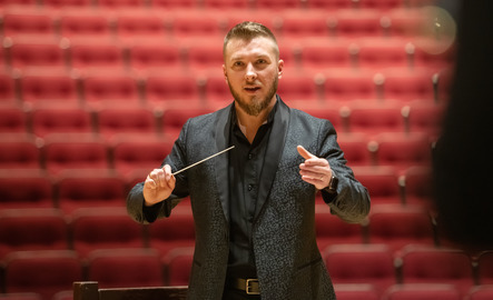 Music professor conducting UW choir