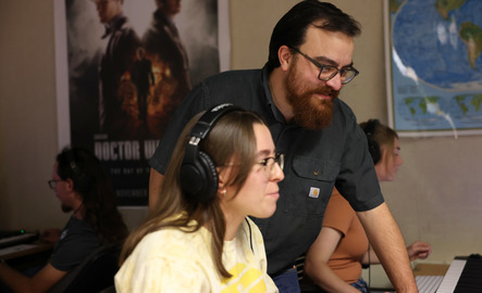Professor and music industry major student work together