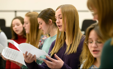Choir students practicing a music performance