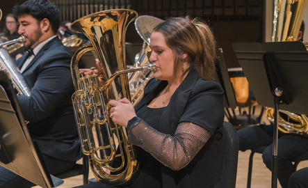 Student playing a brass instrument