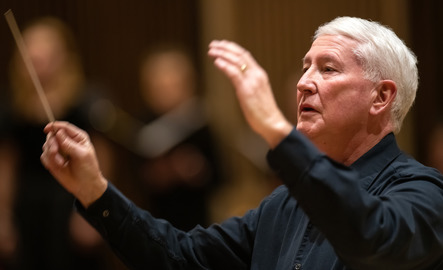 UW faculty member conducting a musical performance