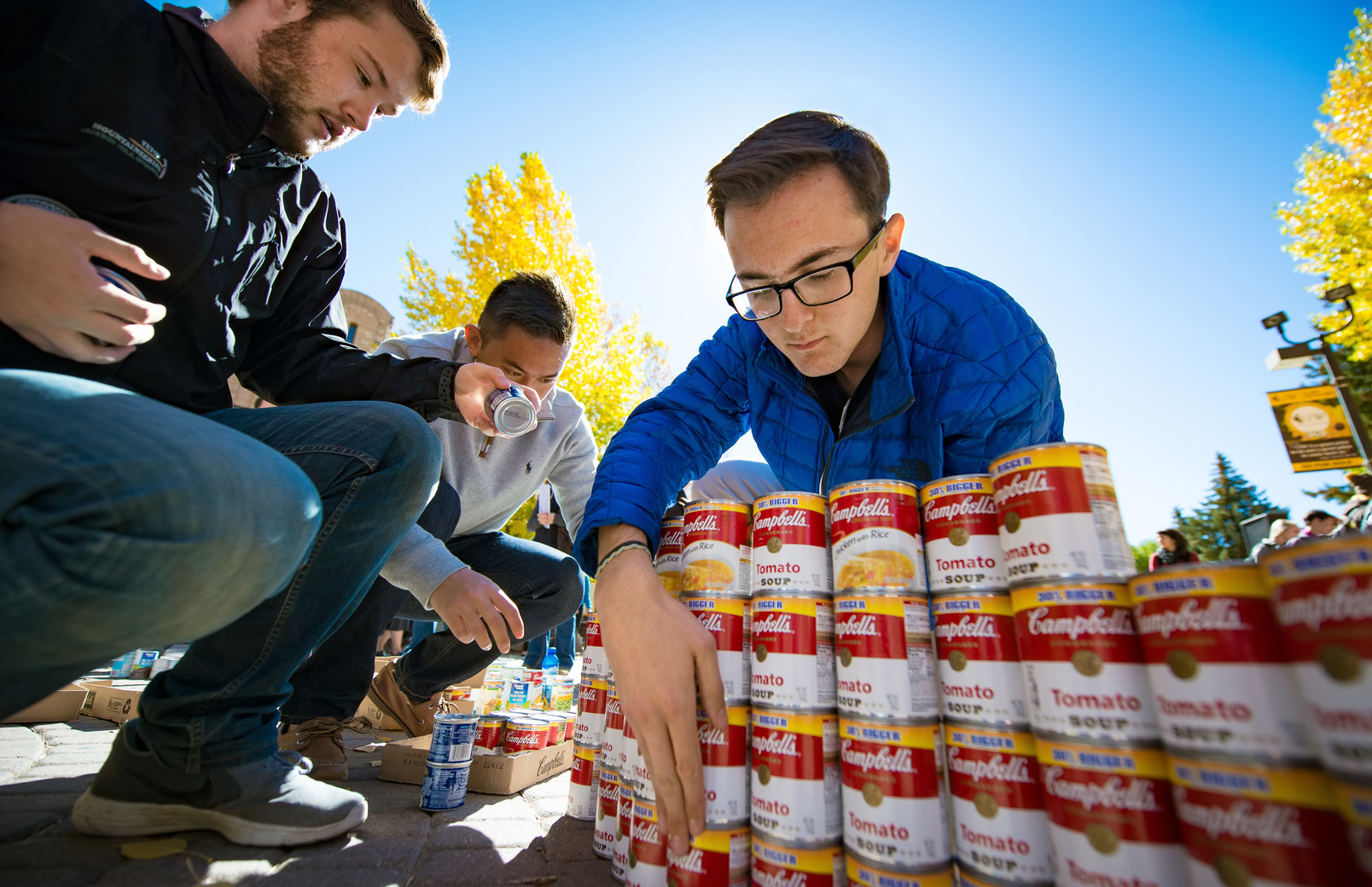 Students stacking soup