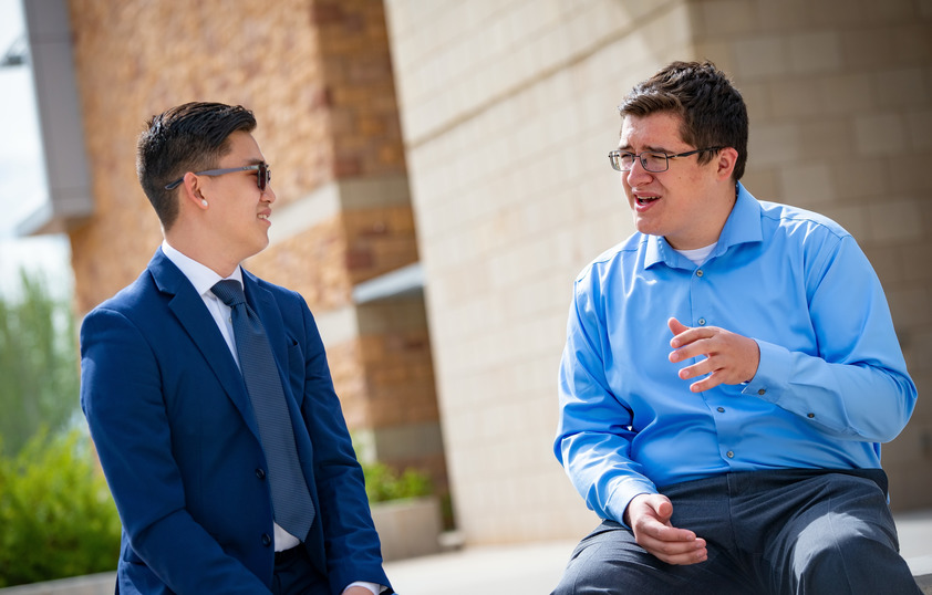 Two students talking to each other