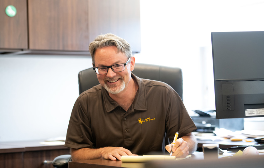 Dean of UW Casper at desk