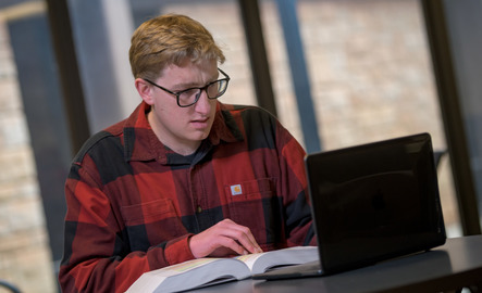 Student works on laptop