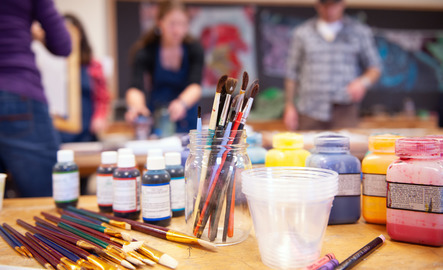 Paintbrushes and paints on a table top