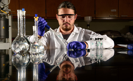 Student in petroleum engineering lab
