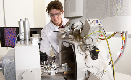 Student working with lab equipment