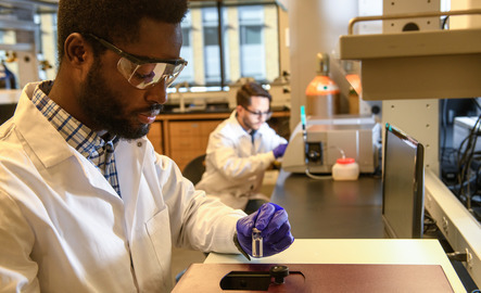 Two students working in a lab
