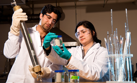 Two petroleum engineering students work together in a lab