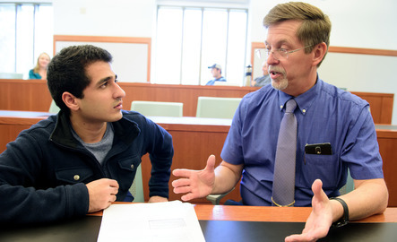 A student and professor in class