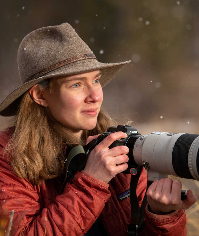 Student holding camera