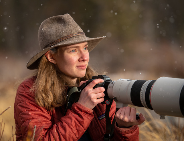 Student holding camera