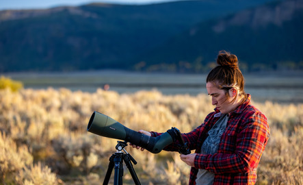 Student with a camera in the field