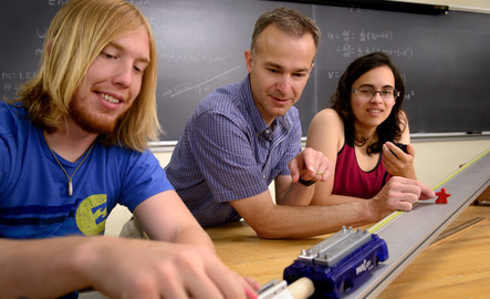 A professor and two students do an experiment