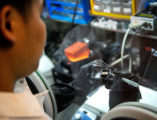Physics grad student in the lab