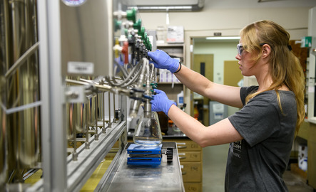 Physics student in the lab doing an experiment