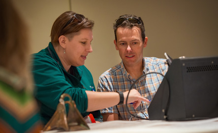 Two students look at a computer together
