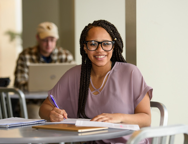Political science student smiles for a photo