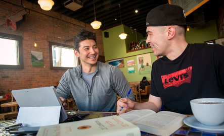 Two students in a cafe