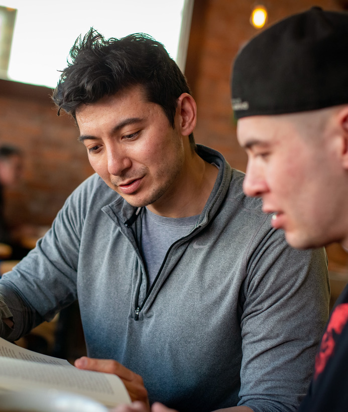 Two political science master's students read a book