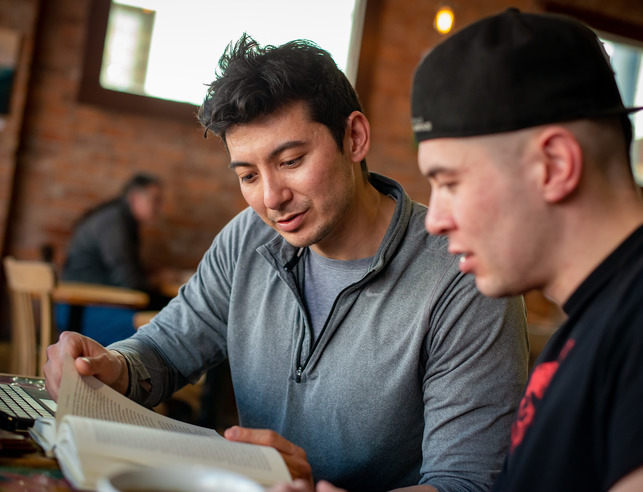 Two political science master's students read a book
