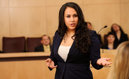 Lawyer speaks to a courtroom