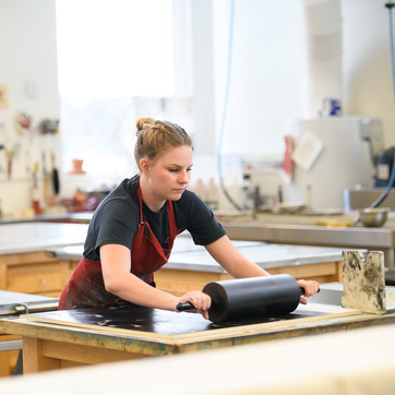 A student in a printmaking studio