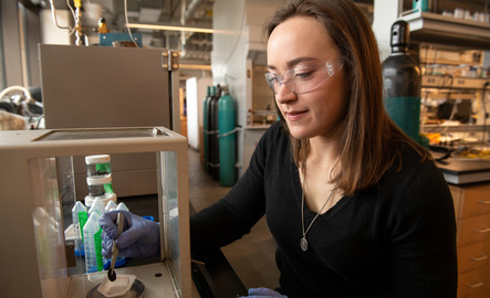 Student working with lab equipment
