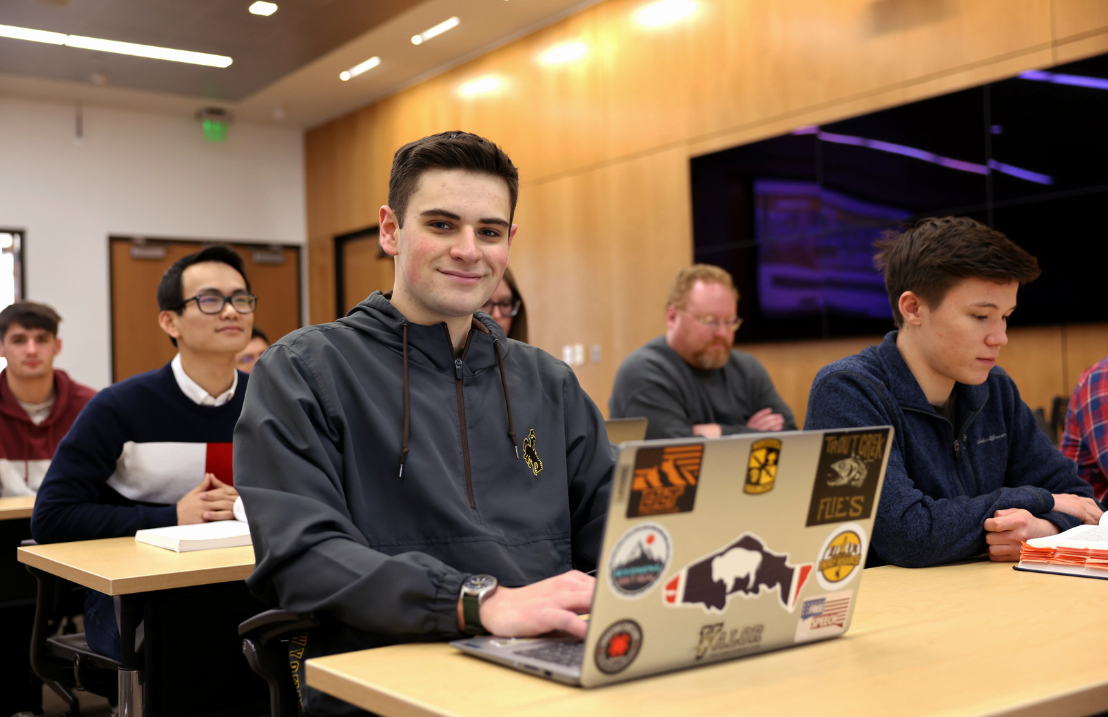 Student smiling for picture in class