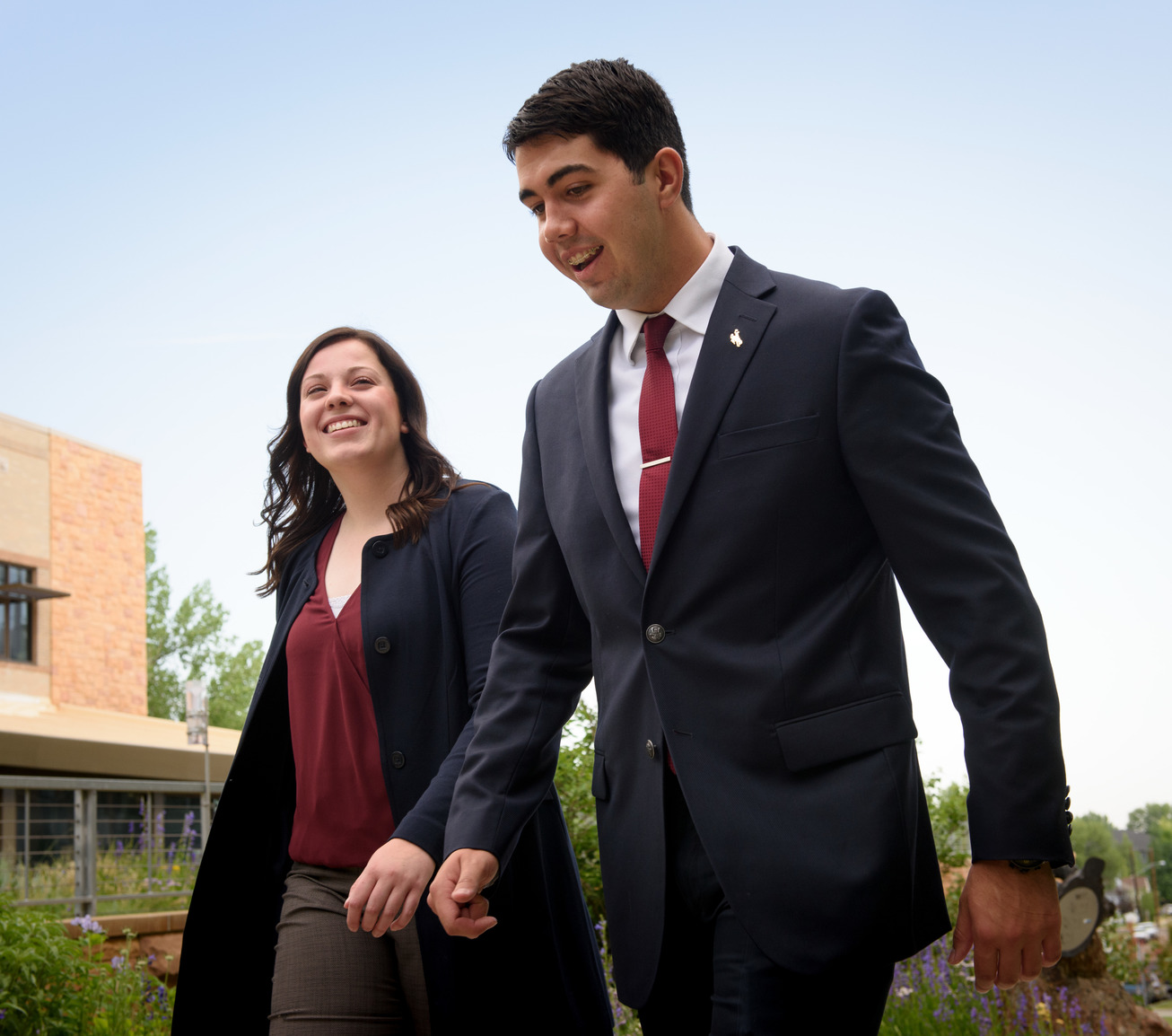 Two students walking on campus