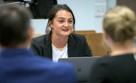 Student sits in a meeting