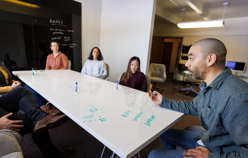 Students working together on a white board