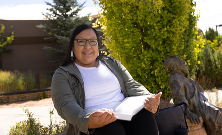 A law student smiles for a picture