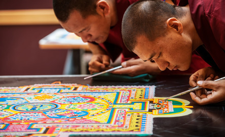 Tibetan Monks creating a mandala sand painting in the UW Union
